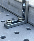 Hassle Free 5/8 Quick Release Ball Lock Pins For Modular Welding Fixture Tables 4 Pack displayed on a welding table surface.