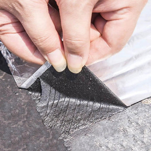 Heavy Duty Roof Repair Tape With Aluminum Foil, Polymer Modified Asphalt Sealant being applied to a roof surface.