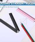Folding Straight Ruler 12 Inch Aluminum Alloy Handy Protractor And Angle Ruler Geometric Measuring Tool For Architects Artists Designers Classroom And Office Use Black, folded on drawing paper