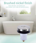 Plug And Play Toe Touch Bathtub Drain Stopper In Smooth Brushed Nickel for easy tub swaps displayed in a modern bathroom setting.