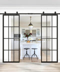 Double Barn Door Set 60x84 Inch With 13 Foot Top Mounted Hardware Kit Includes Two 30x84 Clear Tempered Glass Panels In Black Aluminum Frame Ready For Easy Assembly And Smooth Quiet Sliding installed between kitchen and living room