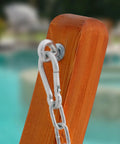 Close-up of carabiner and chain on 13 Ft Outdoor Arc Wood Hammock Stand For Two People With Pine Frame, Natural Finish
