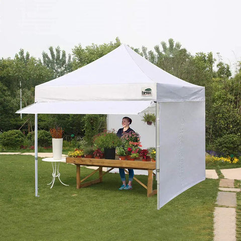 10x10 Pop Up Canopy Tent With No Tip Rolling Bag, Heavy Duty Instant Shelter Gazebo, 30 Sq Ft Extension Awning And 4 Zippered Removable Walls, UV And Water Resistant, White Commercial Outdoor Tent For Events set up in a garden.