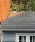 Installed Solar Attic Exhaust Fan 12 Inch 80 Watt Plug And Play Whisper Quiet Ventilation on rooftop beside chimney