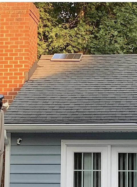 Installed Solar Attic Exhaust Fan 12 Inch 80 Watt Plug And Play Whisper Quiet Ventilation on rooftop beside chimney