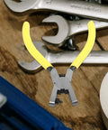 Handheld Single Hole Punch Plier for Paper and Tags with 2mm Metal Punch displayed on a workbench with tools and tape