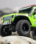 Close-up of Maverix MT RC Tires For 1 30 Scale Axial SCX30 34x12mm with dense tread blocks on rocky terrain