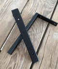 Heavy Duty Wall Mounted L Shape Shelf Brackets Two Pack Slick Black Finish Rust Proof Steel on wood surface.