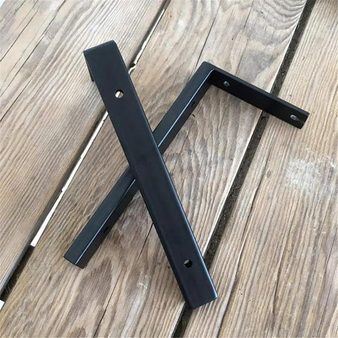 Heavy Duty Wall Mounted L Shape Shelf Brackets Two Pack Slick Black Finish Rust Proof Steel on wood surface.