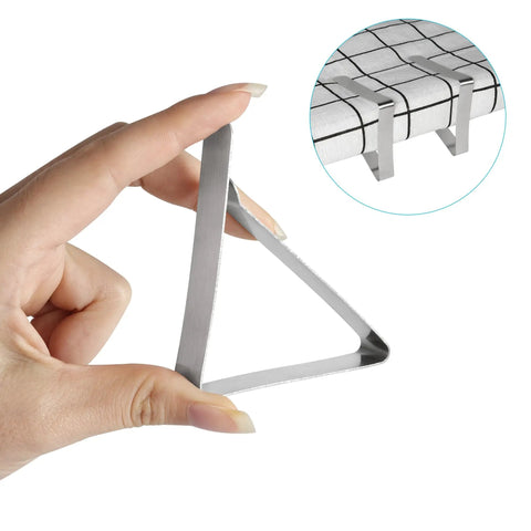 Hand holding Heavy Duty Stainless Steel Tablecloth Clips 16 Pack For Outdoor Tables Stay Put No Slip Metal Picnic Table Clips