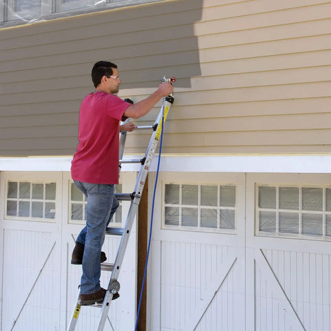 Man using Heavy Duty Airless Paint Sprayer For Interior And Exterior Tasks Featuring Fully Adjustable Pressure Control on a ladder.
