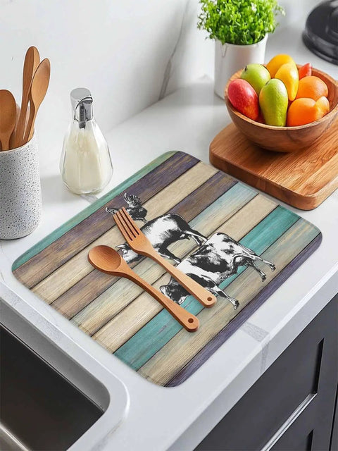 Farmhouse Animal Dish Drying Mat 18x24 Inches with Wood Grain look on countertop with utensils and fruit bowl