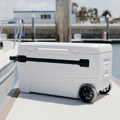 MaxCold Glide 110 Qt Insulated Rolling Cooler With Soft Ride Wheels 168 Can Capacity shown dockside with handle extended