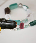 Kick Your Projects Into High Gear With This Epic 40-Piece Buffing Wheel Set For Drills Featuring Heavy Duty Fiber And Alloy Wheels That Polish Wood Or Plastic Fast Without The Frustration For Serious Pro Vibes. Image showing a drill with a buffing wheel polishing a colorful beaded necklace.