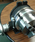 Boss Tier 12 Inch Precision Horizontal Vertical Rotary Table With Slick Gear Drive And 10 Inch Three Jaw Chuck showcasing detailing of the chuck and dial.