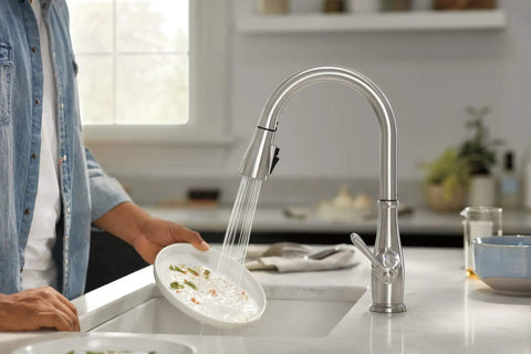 Elmhurst Pull Down Sprayer Kitchen Faucet in Brushed Nickel with dual spray, single-hole installation, showing water flow on a plate