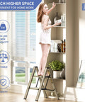 Woman using Three Step Folding Ladder Stool With Anti Slip Wide Pedals Aluminum Portable Lightweight Handy Everyday Use For Adults Multi Use At Home And Kitchen Black 330 Lbs Capacity to reach shelf