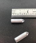 Replacement Clock Weight Set Cylinder Style Kit For DIY Clock Assembly placed beside ruler for scale