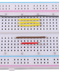 560 Piece Jumper Wire Kit With 14 Lengths For Breadboard Prototyping And Arduino Projects, wires inserted in breadboard.