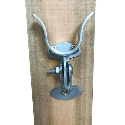 1 3 8 Inch Flat Back Wall Mount Fork Gate Latch For Chain Link Fence Posts installed on wooden post, showing galvanized steel, with screws.