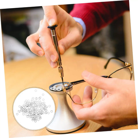 Rimless Eyeglasses Repair Washers Kit With 200 Pieces Of Metal Flat Gaskets For Quick Frame Tightening being used on glasses