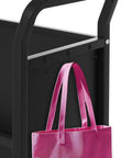 V Shaped Metal Rolling Book Cart With Three Tier Shelves, Side Hooks, Lockable Wheels, black cart with pink bag on hook