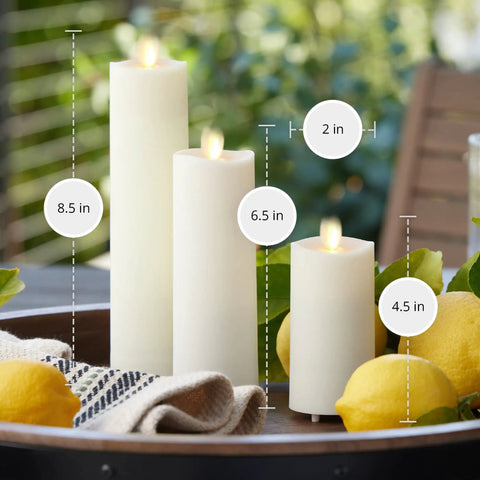 Outdoor Slim Pillar Flameless Led Candles Set Of 3 Ivory With Moving Flame on patio table with lemons and cloth