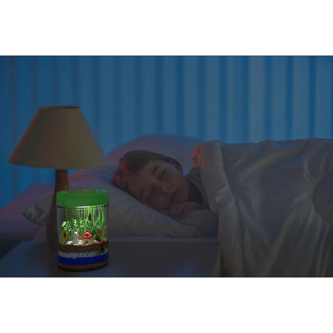 Child sleeping beside Light Up Terrarium Kit For Kids A Fun Hands On STEM Science Toy That Lets Boys And Girls Build A Miniature Garden