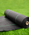 Roll of 17 Inch Wide By 50 Feet Long Heavy Duty Landscape Fabric Weed Barrier Woven Geotextile Ground Cover on grass