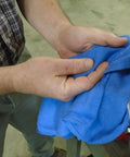 Person holding Blue Industrial Cloth Rags for Auto Mechanics and Janitorial Work, Heavy Duty, Low Lint, Durable and Reusable, 16 By 24 Inch, Cotton Blend