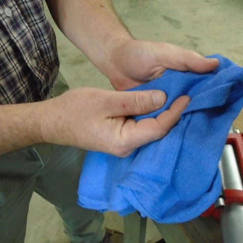 Person holding Blue Industrial Cloth Rags for Auto Mechanics and Janitorial Work, Heavy Duty, Low Lint, Durable and Reusable, 16 By 24 Inch, Cotton Blend