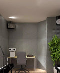 Heavy Duty Sound Proof Padding With Slick Water Resistant Acoustic Foam For Room Noise Cancelling and Super Quick Rebound Egg Crate Wall Panels Easy Peel Stick, in a studio setting.