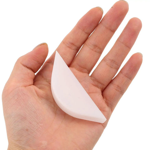 Pro Grade Protective Corner Guards For Picture Frames And Glass Tables held in hand showing durable plastic edge protectors