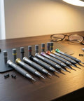 Ultimate 8 Piece Watch Repair Screwdriver Set With Hex Head Metal Shafts And Lightweight Aluminum Body arranged on a wooden table.