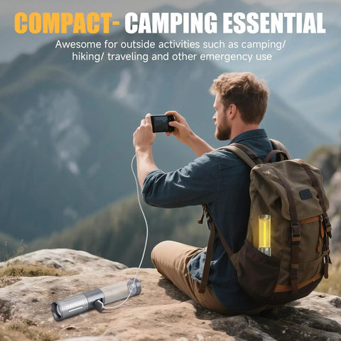 Man using smartphone with 2 In 1 Rechargeable Camping Lantern And Flashlight attached to backpack, mountains in background