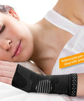 Woman sleeping wearing Wrist Compression Sleeves Pair For Carpal Tunnel Pain Relief And Support For Women And Men.