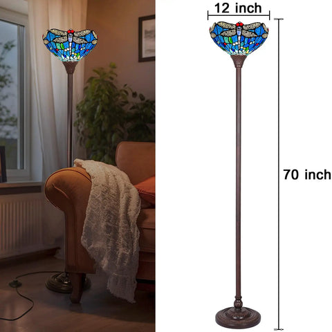 Tiffany Style Stained Glass Torchiere Floor Lamp 70 Inches Tall With Blue Dragonfly Accent next to a couch in a living room