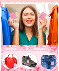 Smiling woman using a tagging gun for clothing kit with 5 needles 3000 barbs 100 price tags 200 snap lock pins 200 safety pins 70 size labels.