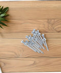 Heavy Duty Lawn Aerator Spikes 12 Pc Set Metal Spikes For Grass Care on wooden surface