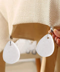12 Piece Teardrop Marble Tablecloth Weights With Metal Clips White for indoor outdoor use clipping on beige linen