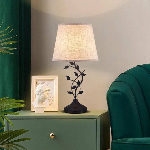 Vintage Tree Branch Base Table Lamp With Beige Shade USB A And USB C Charging Ports on a bedside table in living room.