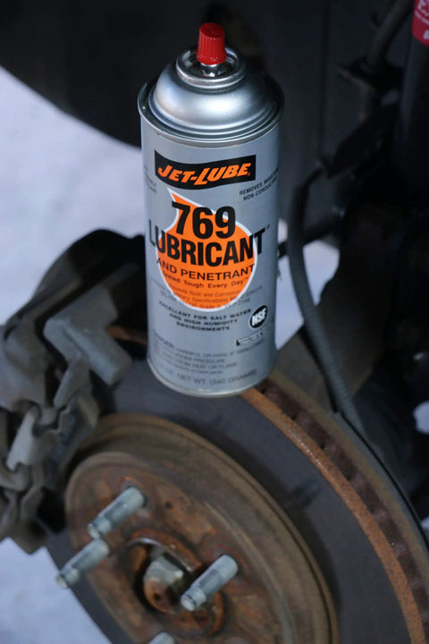 Multipurpose Penetrating Lubricant Aerosol That Digs In Non Flammable Military Grade Rust Inhibitor And Moisture Displacer Tough Corrosion Preventative No Fluorocarbons CO2 Propellant Pack Of 12 Units on a vehicle brake disc