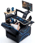 Level Up Your Setup With One Touch Electric Height Adjustable Mobile Gaming Desk Featuring Floating Shelf Dedicated CPU Stand Three Posture Modes And Built In Power Strip, featuring a gamer in a reclining chair with a desktop and monitor.