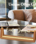 Personalized Light Up Desk Name Plate With Your Name Title Or Motto on wooden base, glowing on office desk.