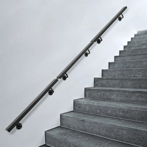 Rock Solid Wall Mounted Stair Handrail Premium Stainless Steel Safety Rail with Pre Drilled Mounting Holes on gray stairs.