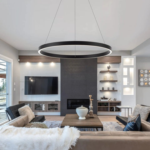 Modern LED Ring Chandelier With Uplight And Downlight, Black Dimmable Circular Pendant Light illuminating a contemporary living room.