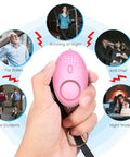 Hand holding pink personal alarm from Safety Keychain Set For Women And Kids, 10 Pack Self Defense Keychains with 110dB sound