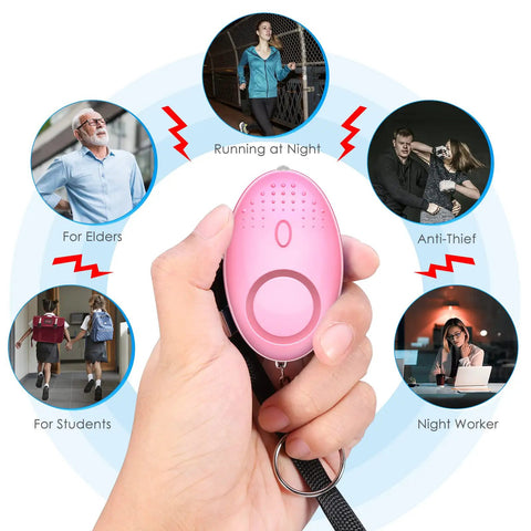 Hand holding pink personal alarm from Safety Keychain Set For Women And Kids, 10 Pack Self Defense Keychains with 110dB sound