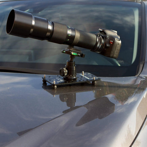 Hassle Free Setup Backpack Ready Low Profile Cheese Plate Mount For Seamless Camera Rigging Compact Flat Tripod Adapter For Dslr Mirrorless Action Cam Creators On The Go mounted on car with DSLR and lens.