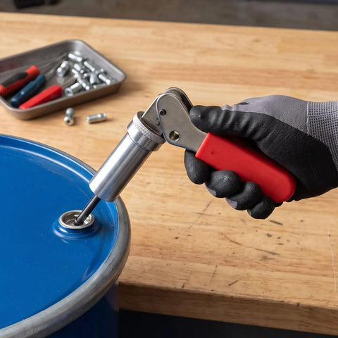 Dope Spring Plunger Tool For 0.158 In Steel Drum Fasteners With Precision Fit and ergonomic grip in use on a steel drum.